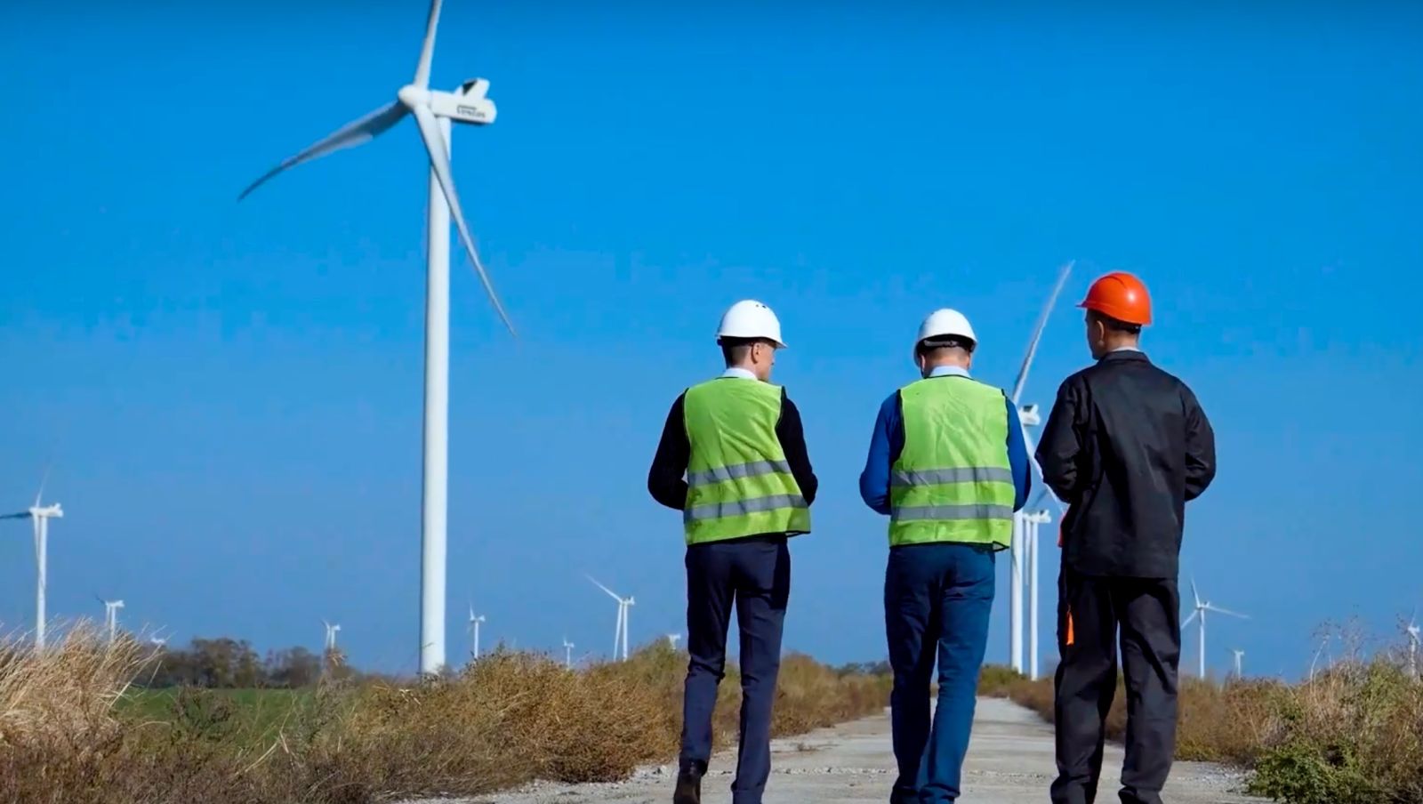 3 men in hard hats