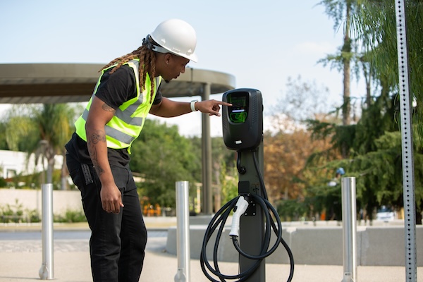 Man adjusting charger