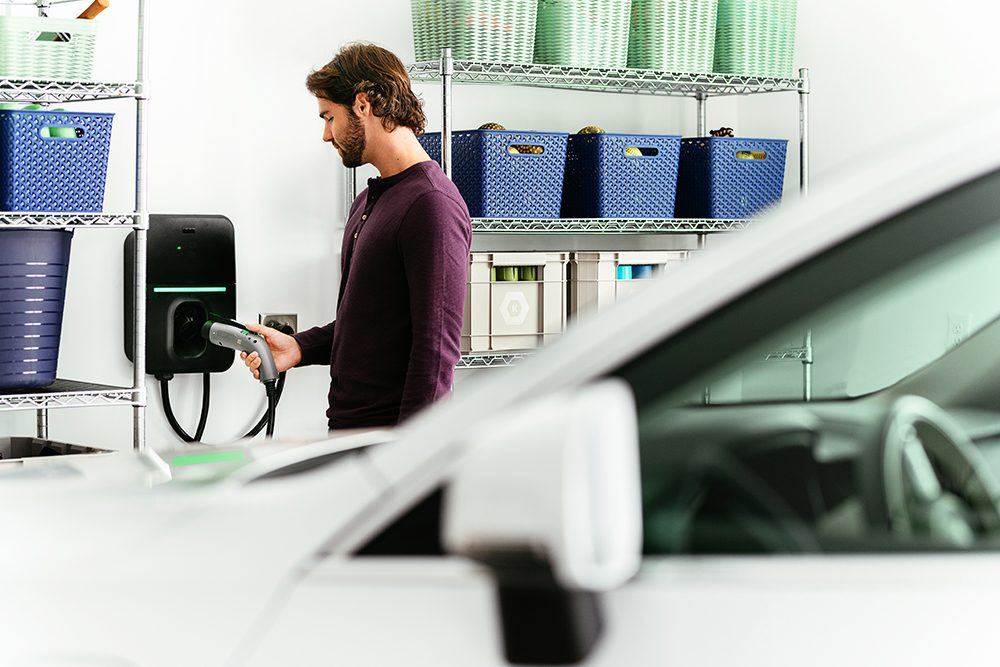 man charging car