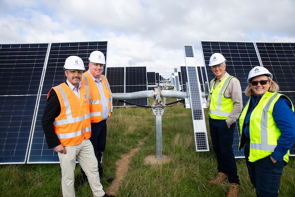 4 people by solar panels