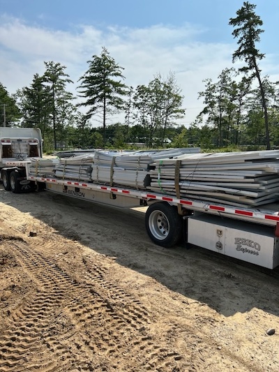 solar panels stacked on truck