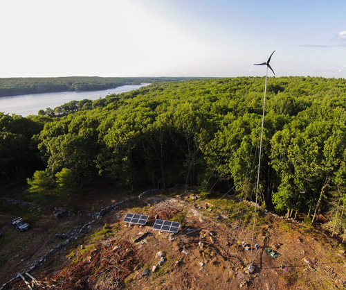 Hybrid renewable energy installation at a home in Georgetown, Maine, featuring distributed wind and solar power (Photography by Will Lones of Pika Energy)